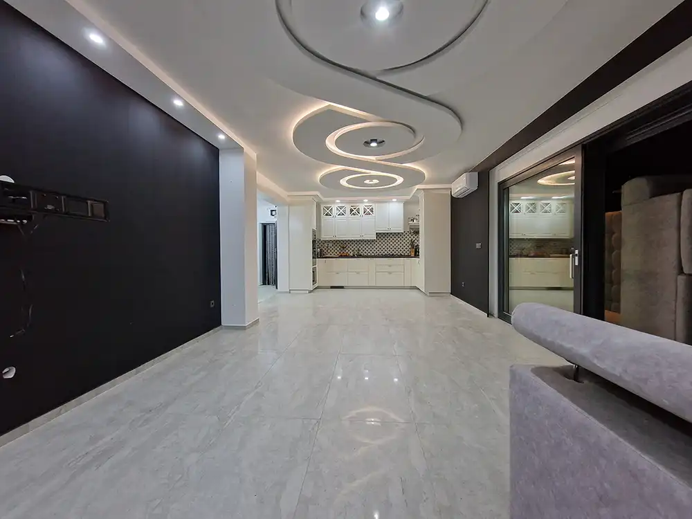 Finished corridor with a decorative ceiling and lighting