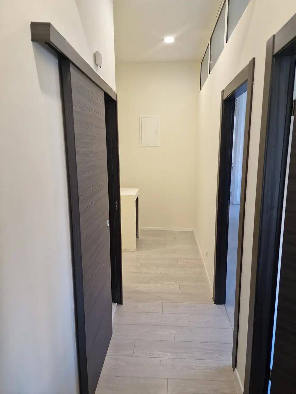 Finished painted corridor walls and a bathroom opening